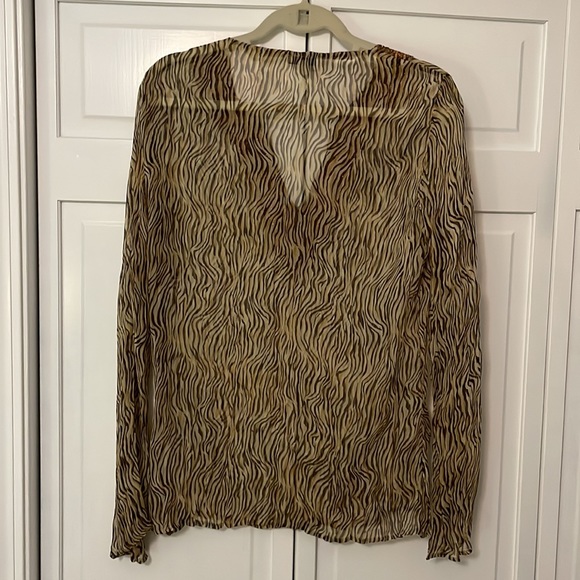 Cache sheer animal print tunic with beautiful beaded detail along v-neck. - Picture 2 of 6